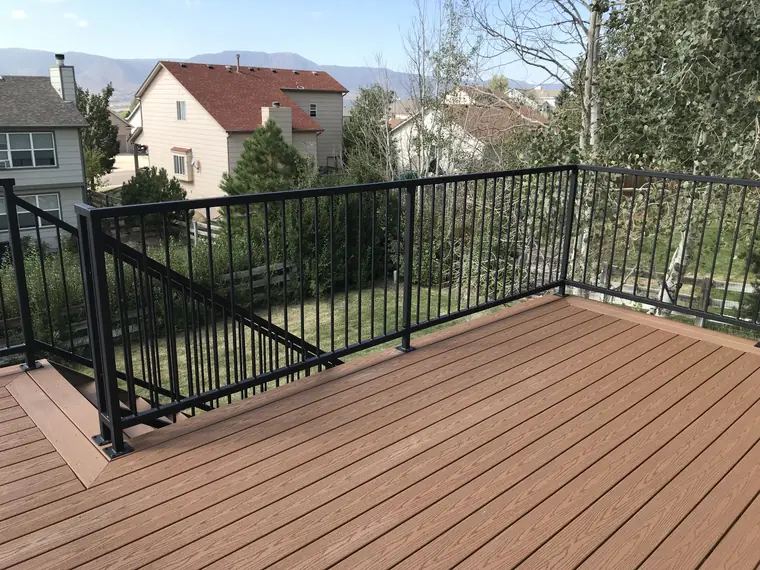 Classic railing around a composite deck looking out to the mountains